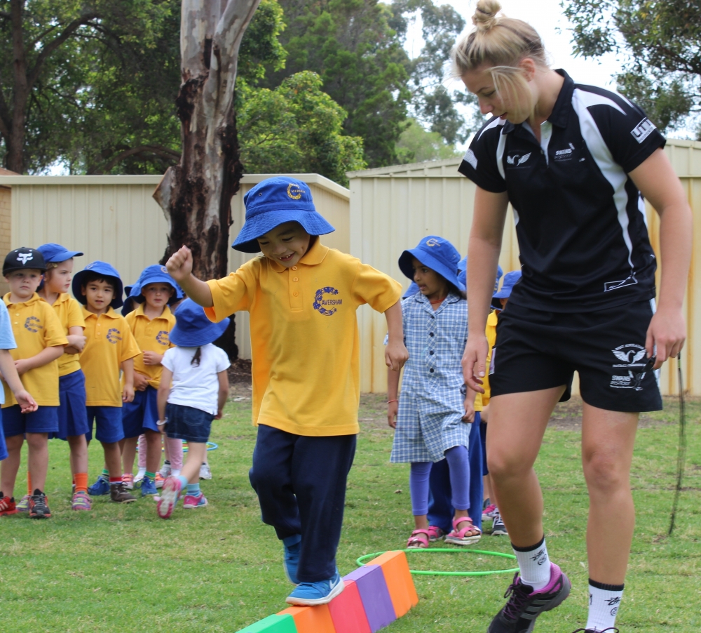 Kindgarten boy doing an obstacle course