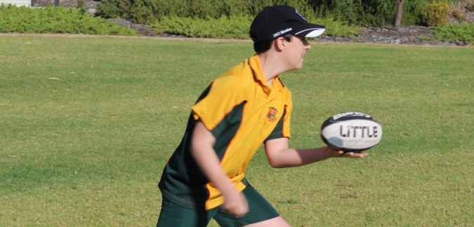 Primary school boy playing football